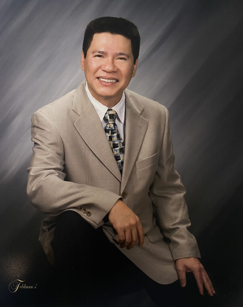 Tuan, smiling