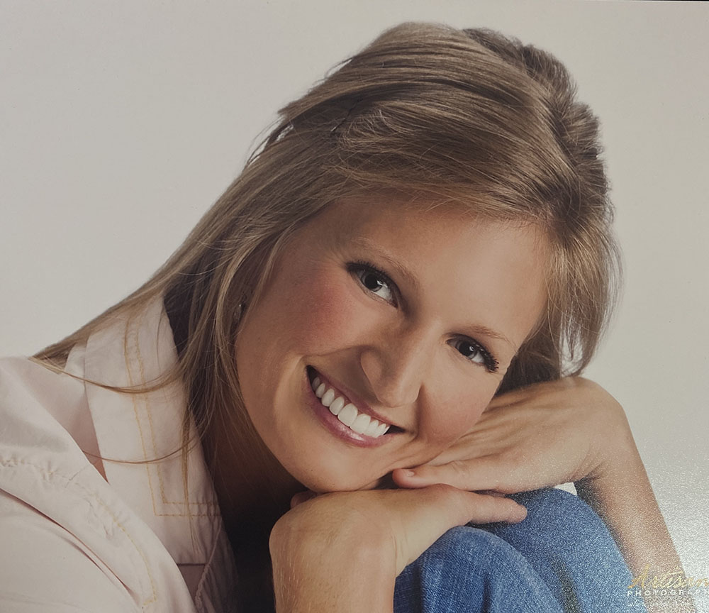 Kim, smiling