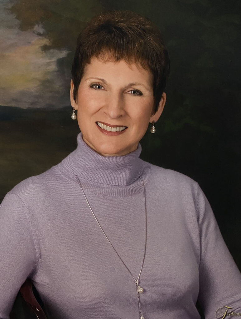 Pam, smiling